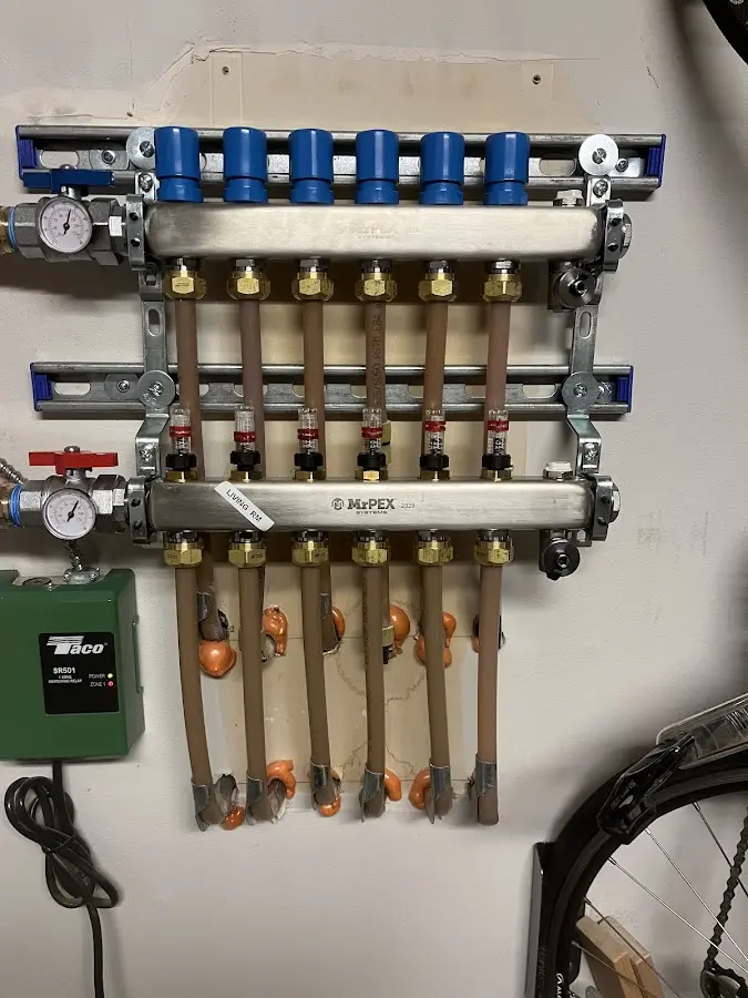 Plumber performing Water Heater Repair at a residential property in Farmington